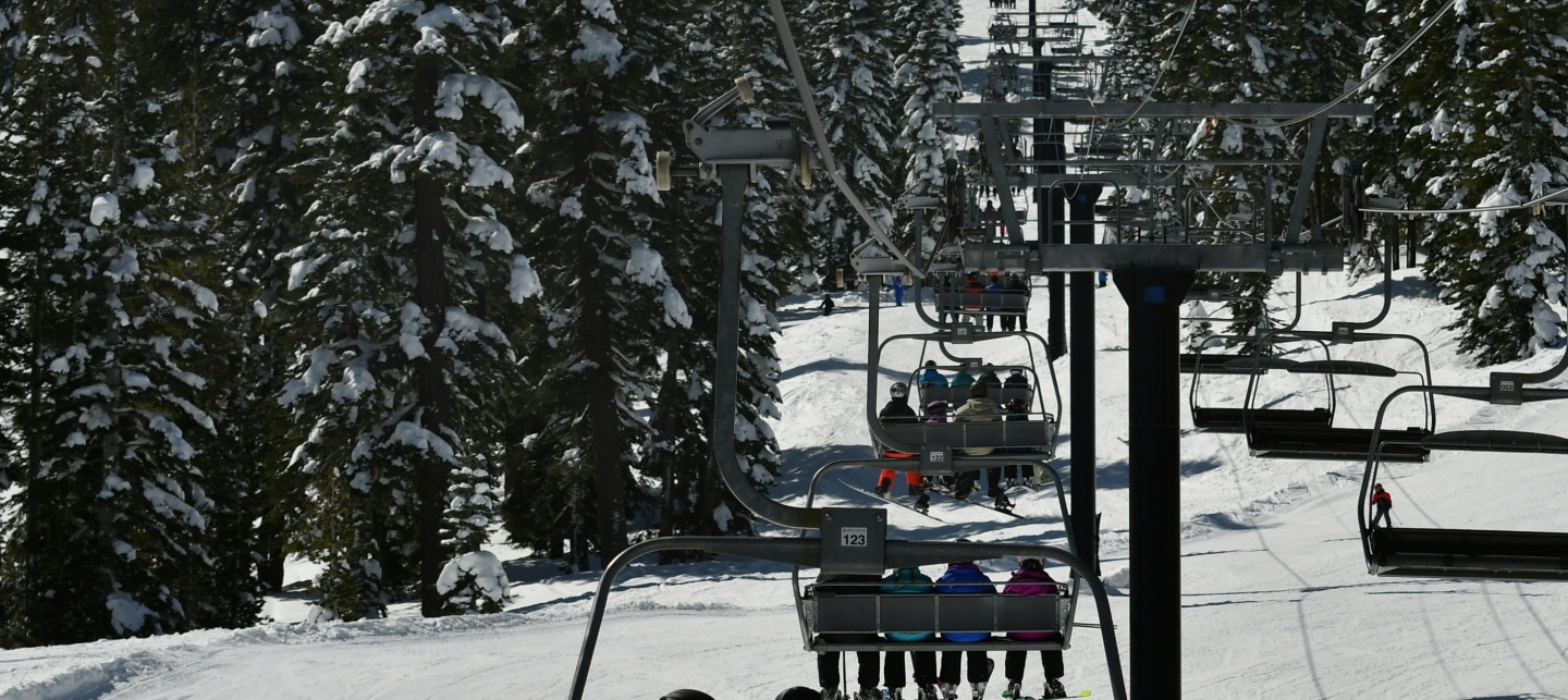 Ski lift in snowy mountain school ski tours