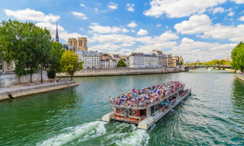 istockphoto-1310443975-612x612 Paris, France - August 21, 2015 : Bateau mouche on the River Seine on a sunny day