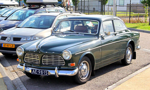 istockphoto-467387490-612x612 North Brabant, Netherlands - August 9, 2014: Swedish retro car Volvo Amazon parked at the interurban road.