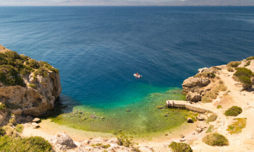 stock-photo-aerial-view-of-perachoras-ireon-lake-in-greece-beautiful-crystal-clear-sea-with-a-boat Ariel view of Perachoras Greece